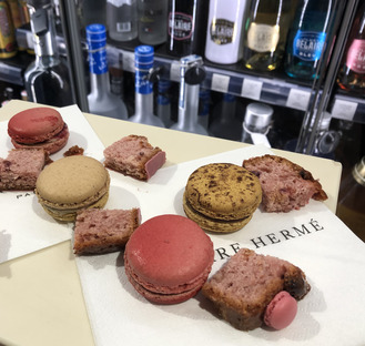 a plate with macarons from the pierre hermé shop different flavours of macarons, very delightful