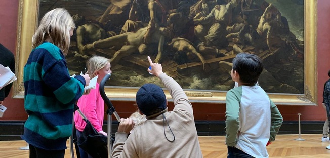 guiding children in front of the raft of the medusa