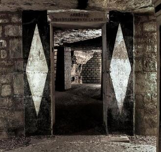 entrance to the boneyard within the catacombs of Paris 