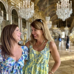 2 sisters enjoying their elevating tour at versailles with the perfect timing inside the hall of Mirror