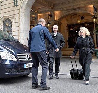 a driver picking up his guests from the parisian grand hotel intercontinental